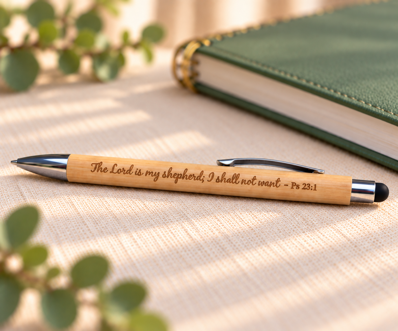Close-up of the bamboo pen engraved with “The Lord is my Shepherd.”